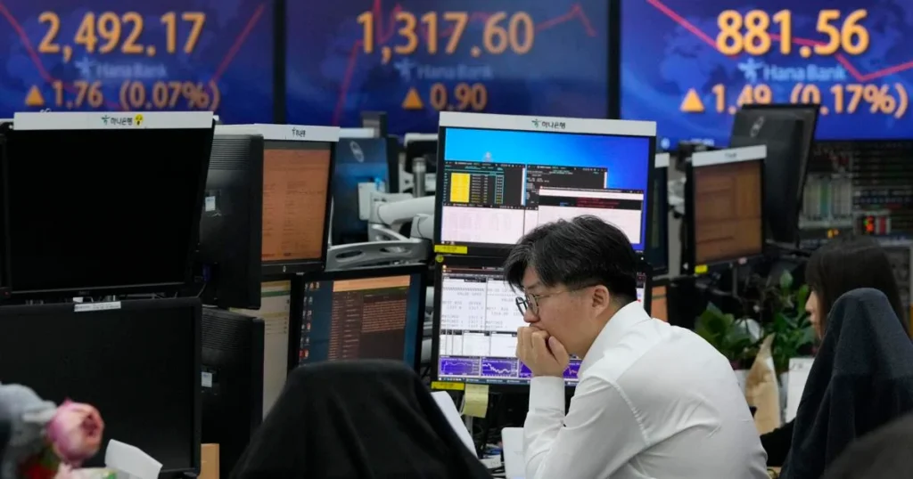 Asian stocks mostly down after mixed session on Wall Street