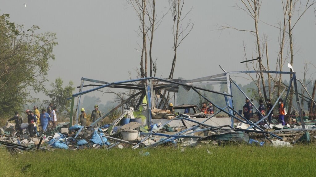 Remains of fireworks explosion victims taken to Thai temple where families give DNA to identify them